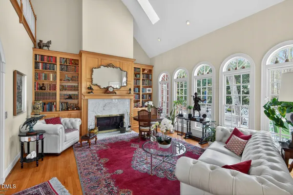 a living room with furniture fireplace and a fireplace