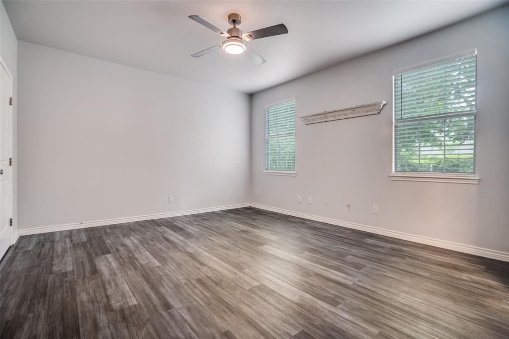 1503 Cherry Street Gainesville, TX 76240 - Photo 14 of 20 wooden floor in an empty room with a window