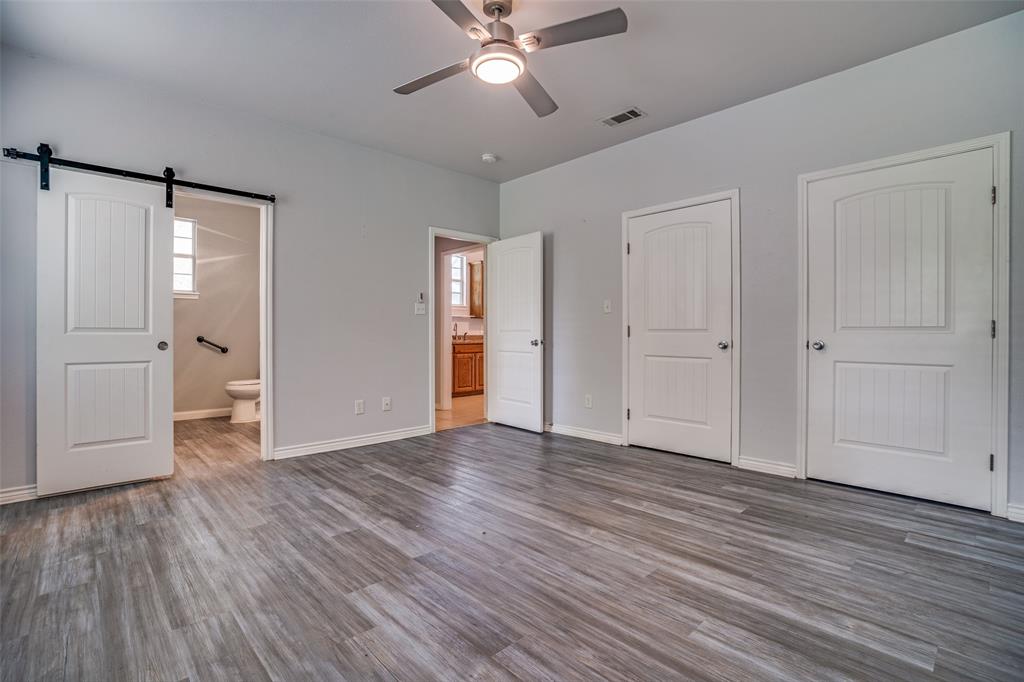 1503 Cherry Street Gainesville, TX 76240 - Photo 15 of 20 a view of an empty room with wooden floor