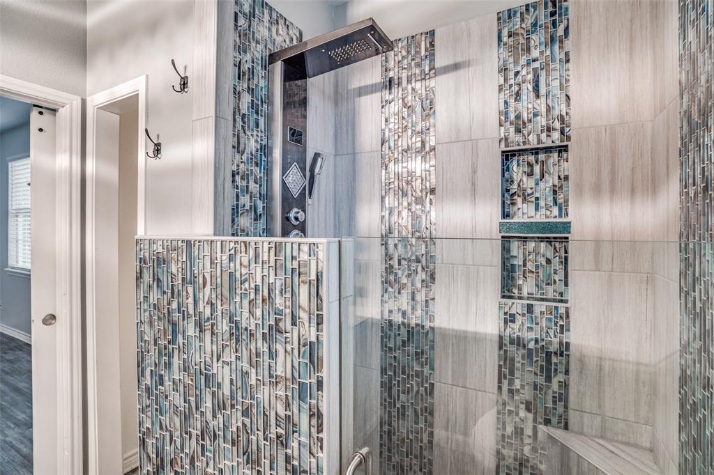 1503 Cherry Street Gainesville, TX 76240 - Photo 17 of 20 a bathroom with a shower and a glass door