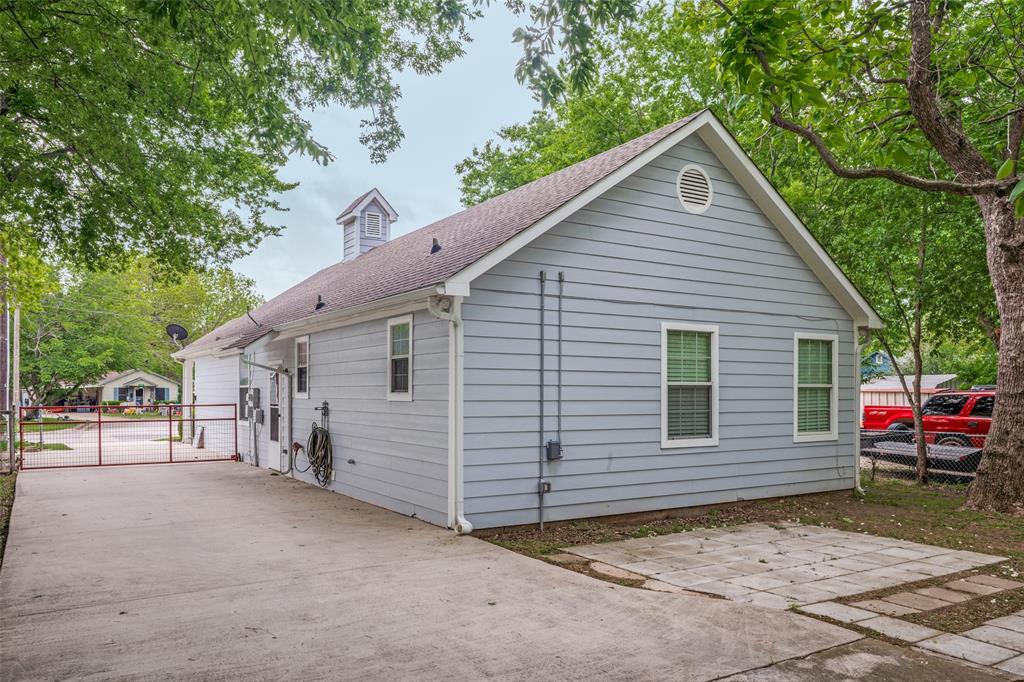 1503 Cherry Street Gainesville, TX 76240 - Photo 18 of 20 a view of a house with a patio