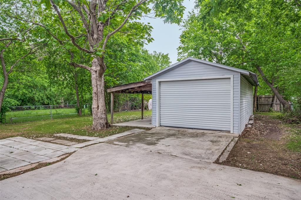 1503 Cherry Street Gainesville, TX 76240 - Photo 20 of 20 a view of backyard of house with green space
