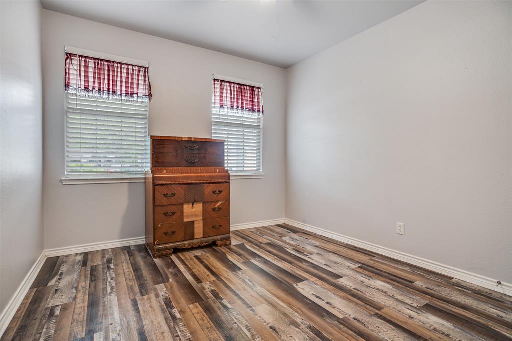 1503 Cherry Street Gainesville, TX 76240 - Photo 9 of 20 a view of a room with wooden floor