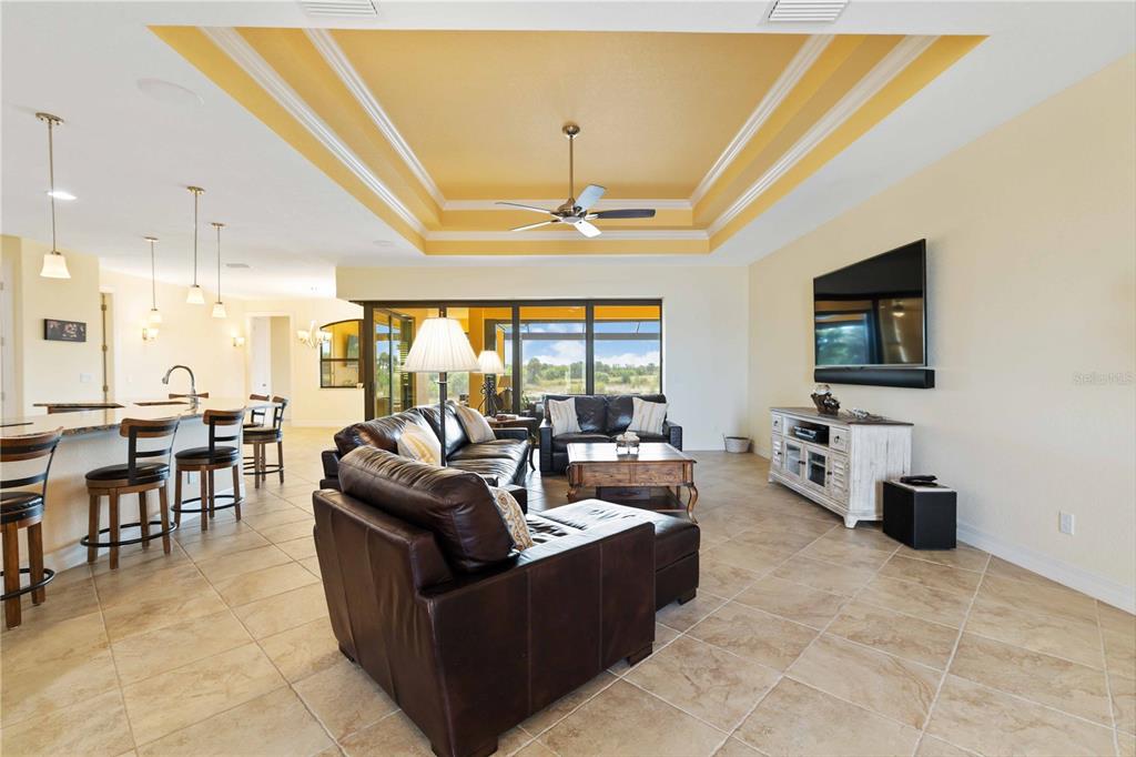 11626 Bridle Path Lane Placida, FL 33946 - Photo 12 of 51 a living room with fireplace furniture and a flat screen tv