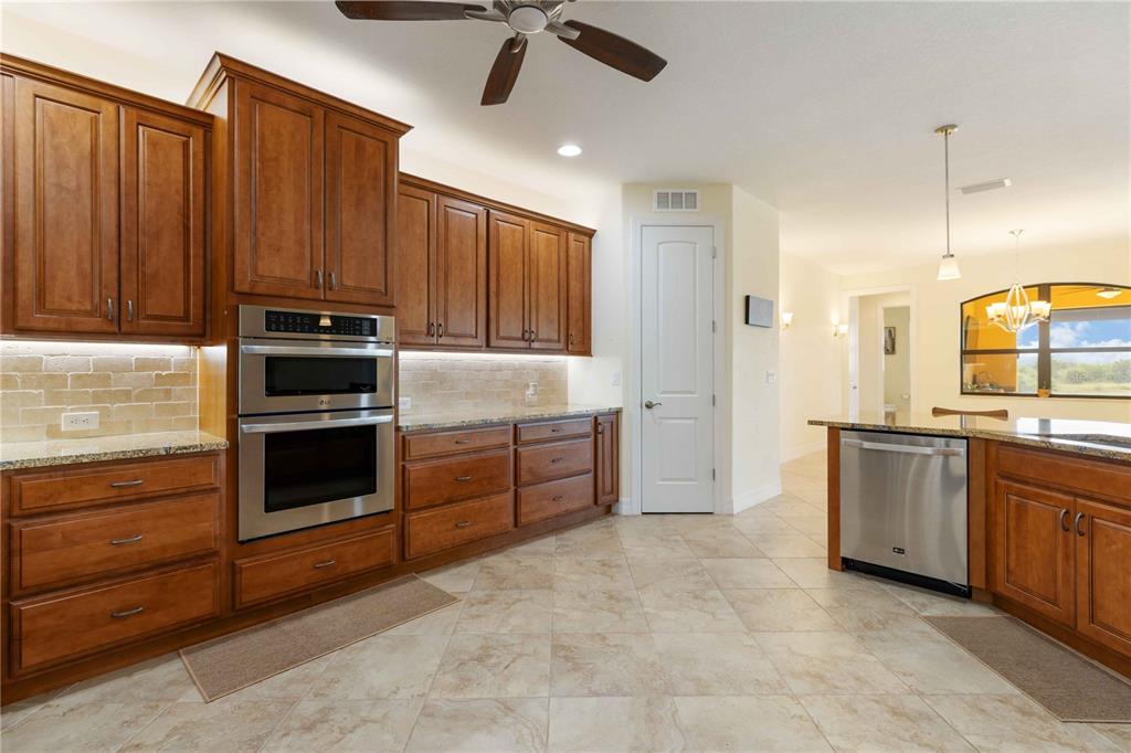 11626 Bridle Path Lane Placida, FL 33946 - Photo 17 of 51 a large kitchen with cabinets
