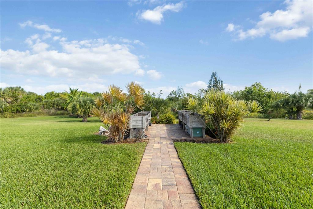 11626 Bridle Path Lane Placida, FL 33946 - Photo 40 of 51 a view of a garden with an trees