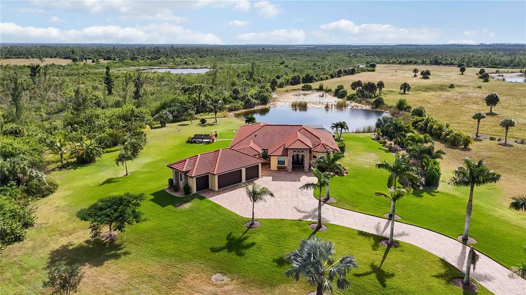 11626 Bridle Path Lane Placida, FL 33946 - Photo 44 of 51 a view of a lake with a yard