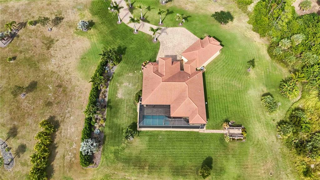 11626 Bridle Path Lane Placida, FL 33946 - Photo 47 of 51 an aerial view of house with yard swimming pool and outdoor seating