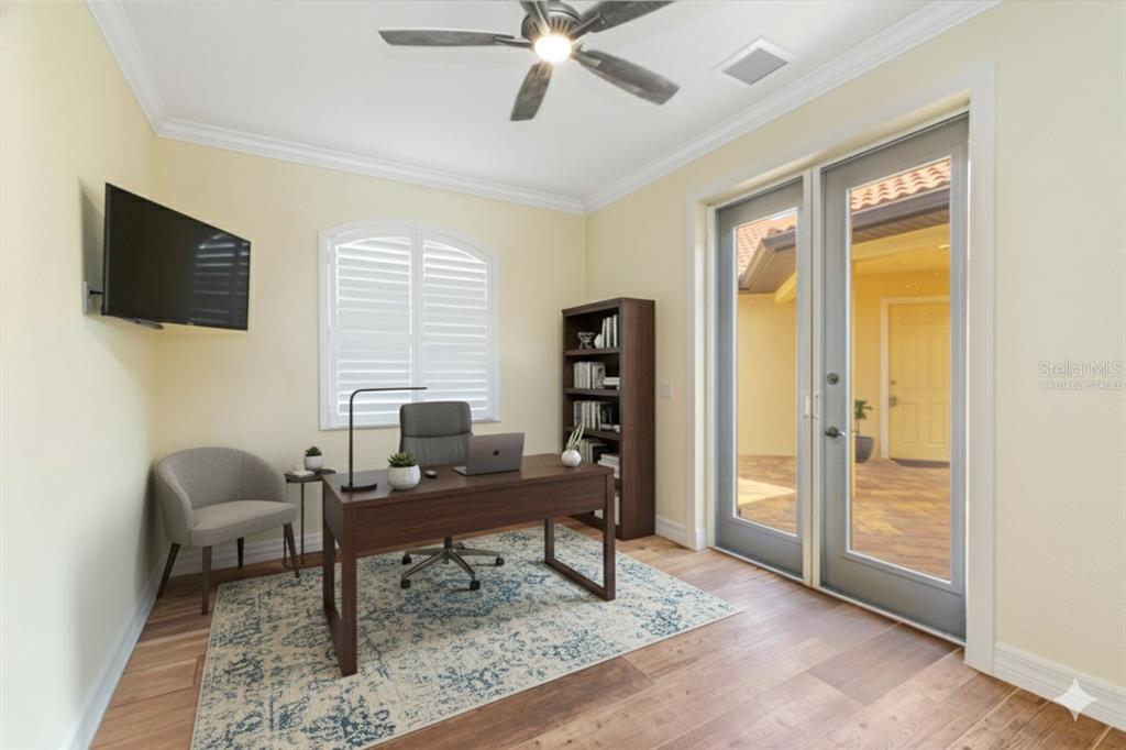 11626 Bridle Path Lane Placida, FL 33946 - Photo 7 of 51 a view of a workspace with furniture and a window