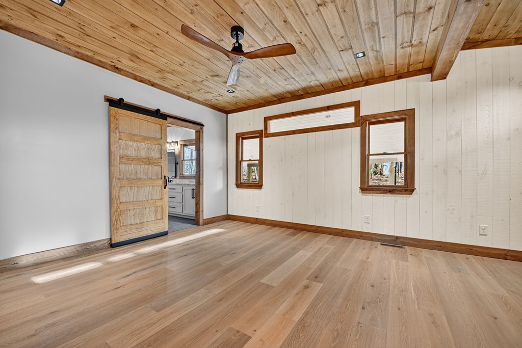 21 Mountain Trace Cherry Log, GA 30522 - Photo 19 of 49 an empty room with wooden floor closet and windows