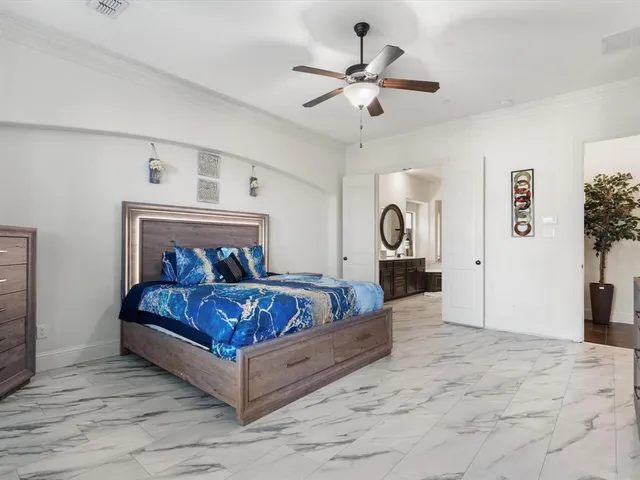 a kitchen with stainless steel appliances granite countertop a stove top oven a sink a dining table and chairs