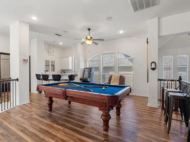 a room with furniture and wooden floor