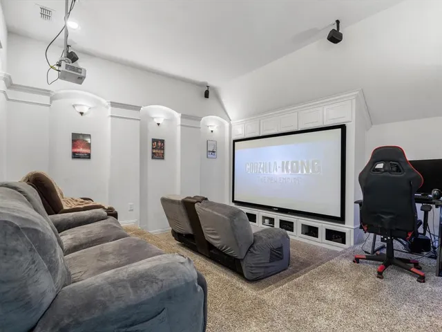 a living room with a table chairs and a table