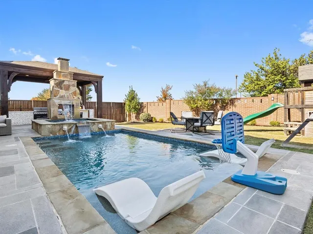 a kitchen with stove and cabinets