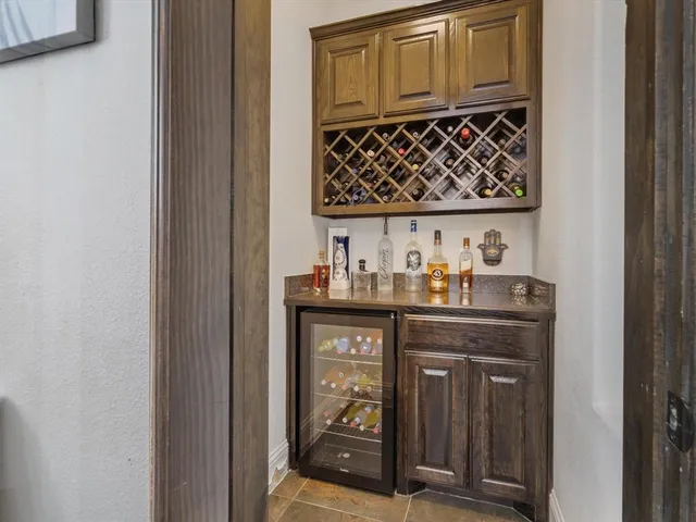 a kitchen with granite countertop a sink and cabinets