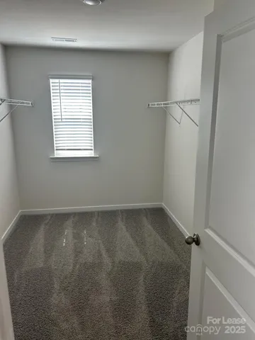 a spacious bathroom with a double vanity sink and a mirror