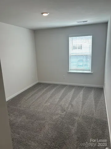 a bathroom with a double vanity sink toilet mirror and bathtub