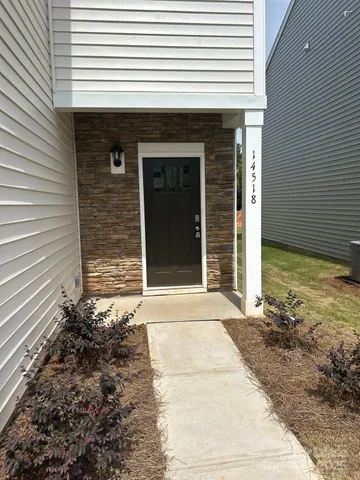 a front view of a house with a garage
