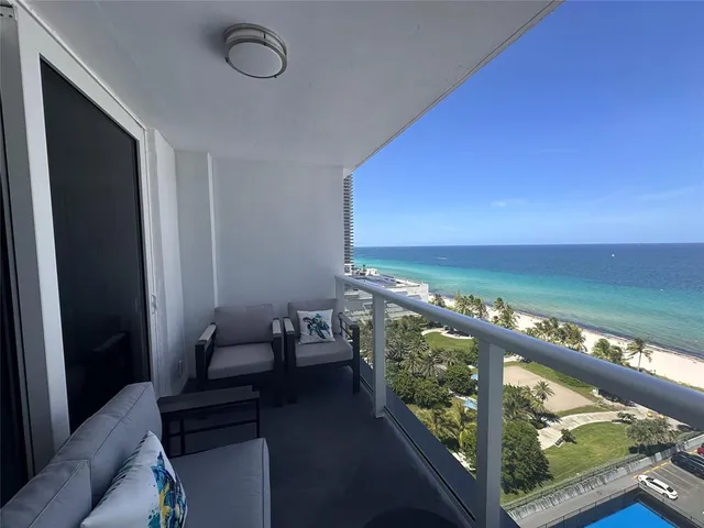 a view of a balcony with an ocean view