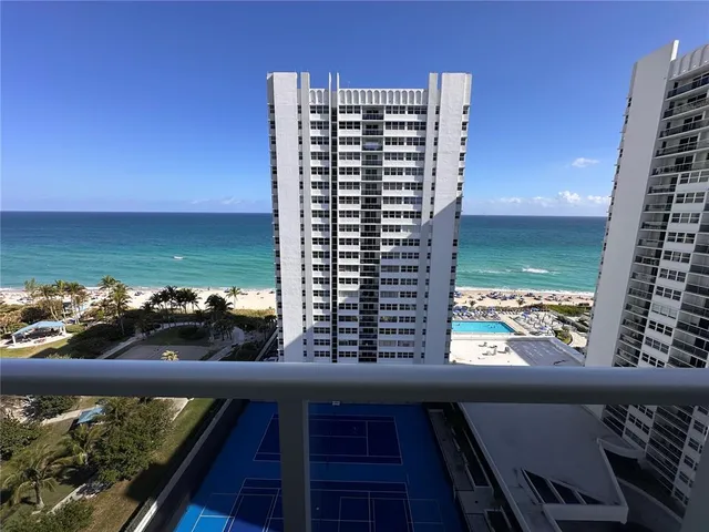 a view of swimming pool with outdoor seating