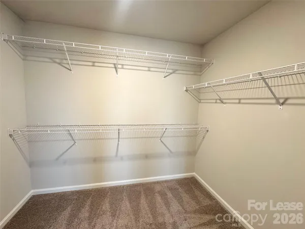 a view of a room with racks on the wall