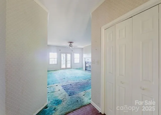 a view of a hallway with windows
