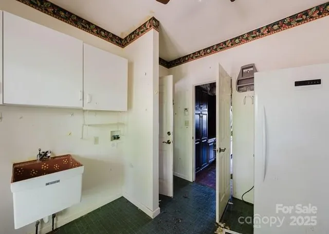 a view of a hallway with wooden floor and entryway