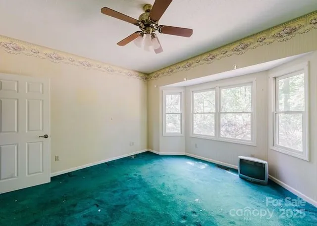 a view of an empty room with a window