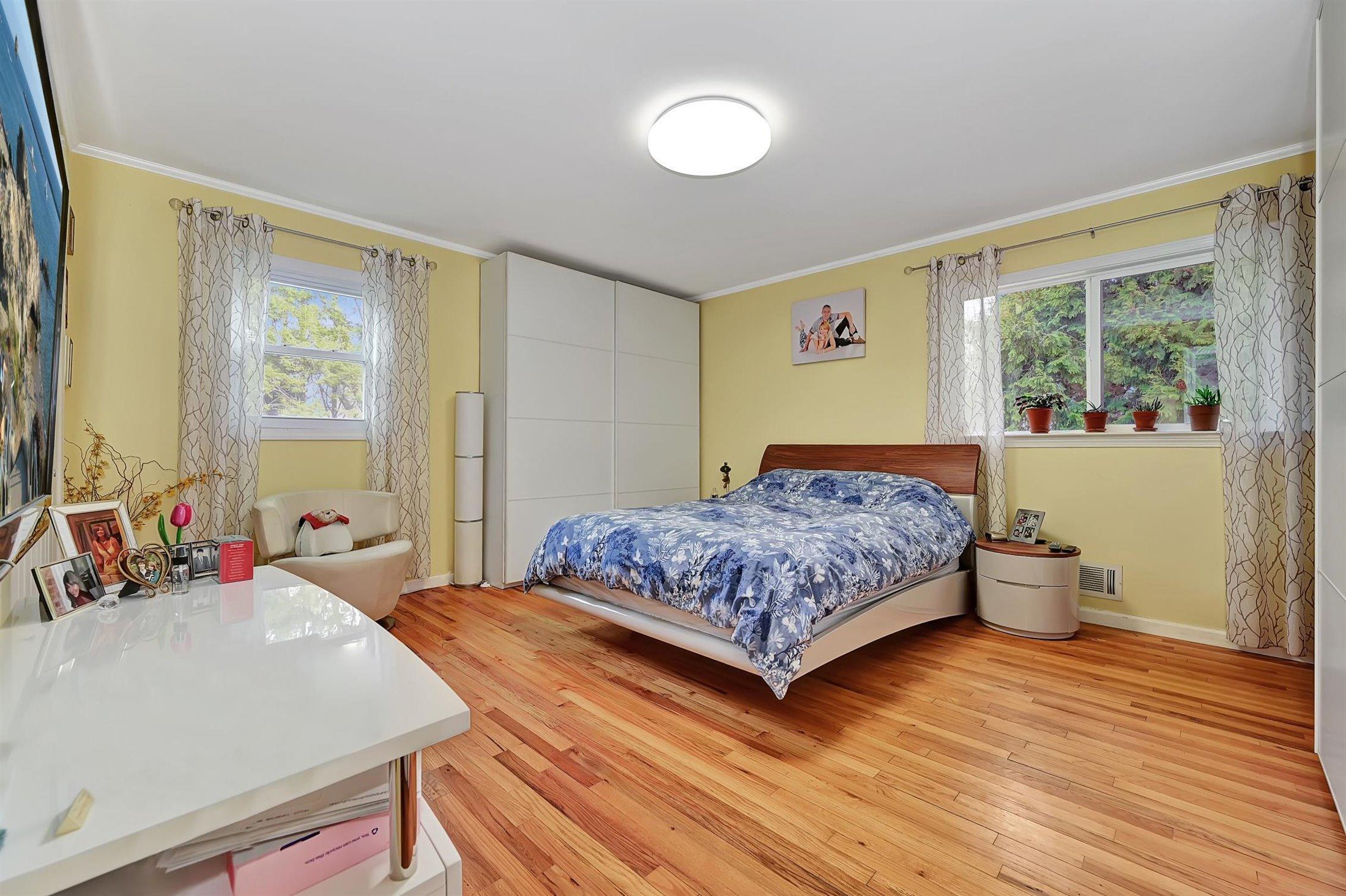 25 Clayton Road Howell, NJ 07731 - Photo 14 of 29 a bedroom with a bed and wooden floor