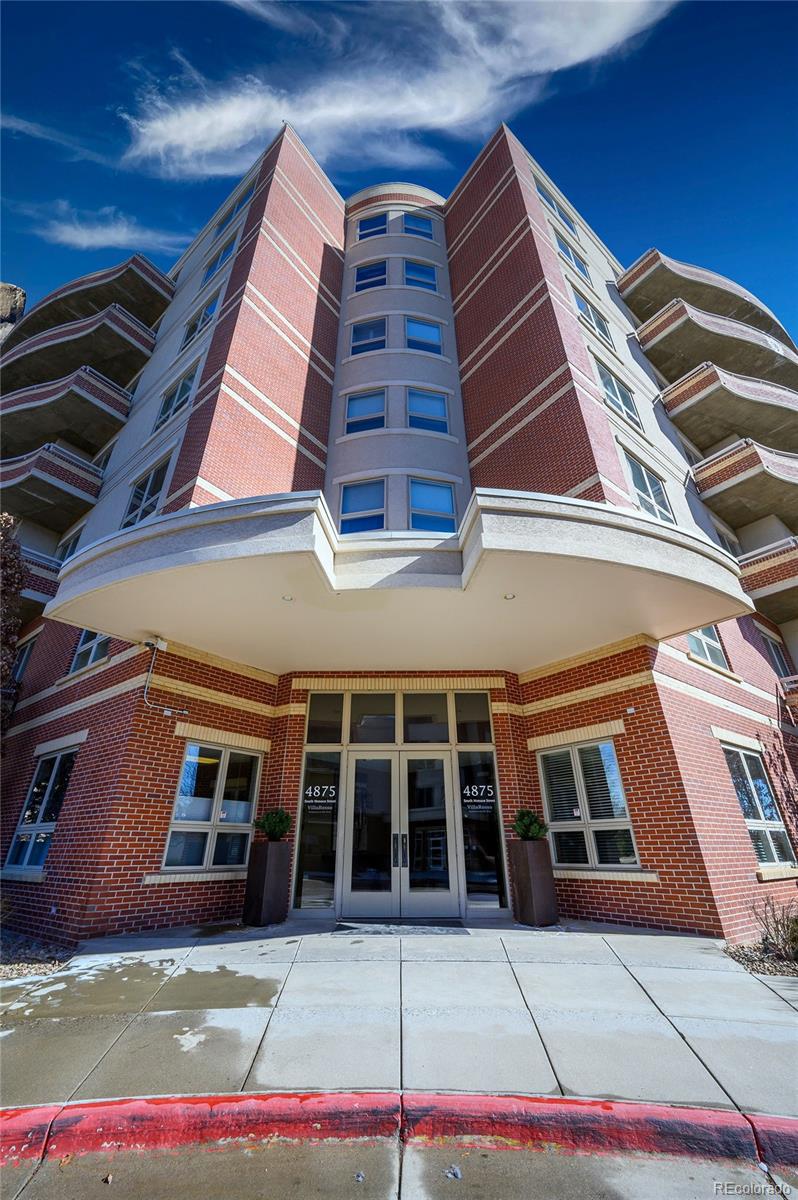 4875 South Monaco Street, Unit 103 Denver, CO 80237 - Photo 1 of 44 a front view of a house
