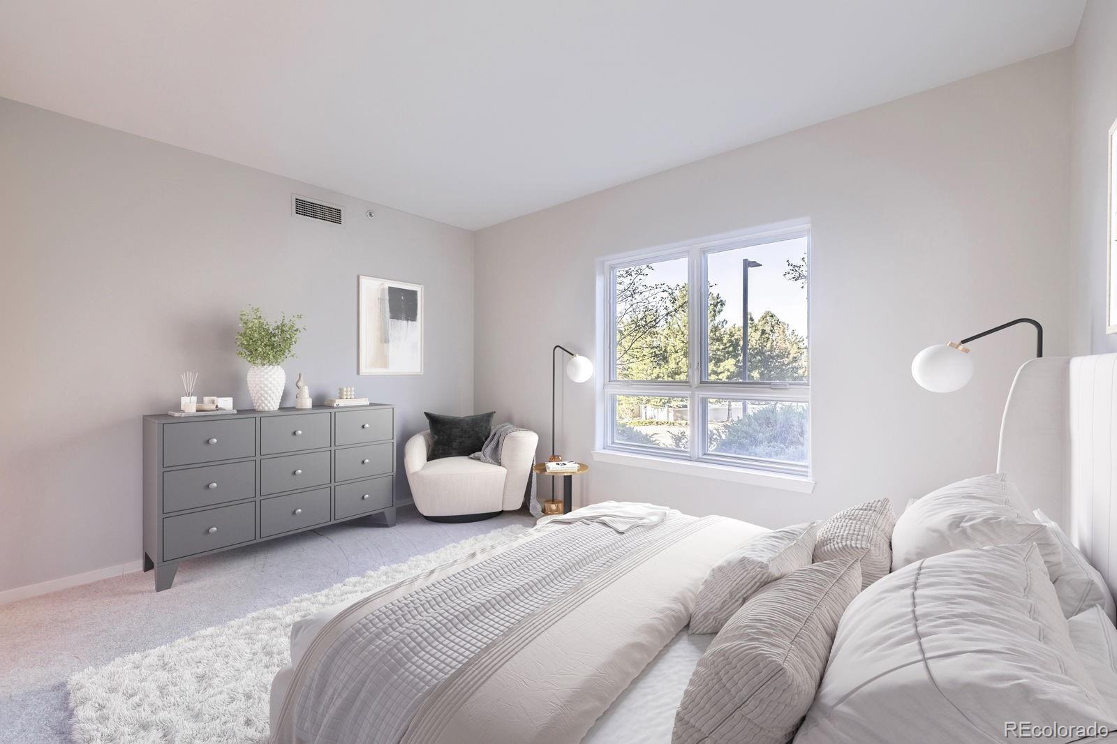 4875 South Monaco Street, Unit 103 Denver, CO 80237 - Photo 11 of 44 a bedroom with a bed and a window