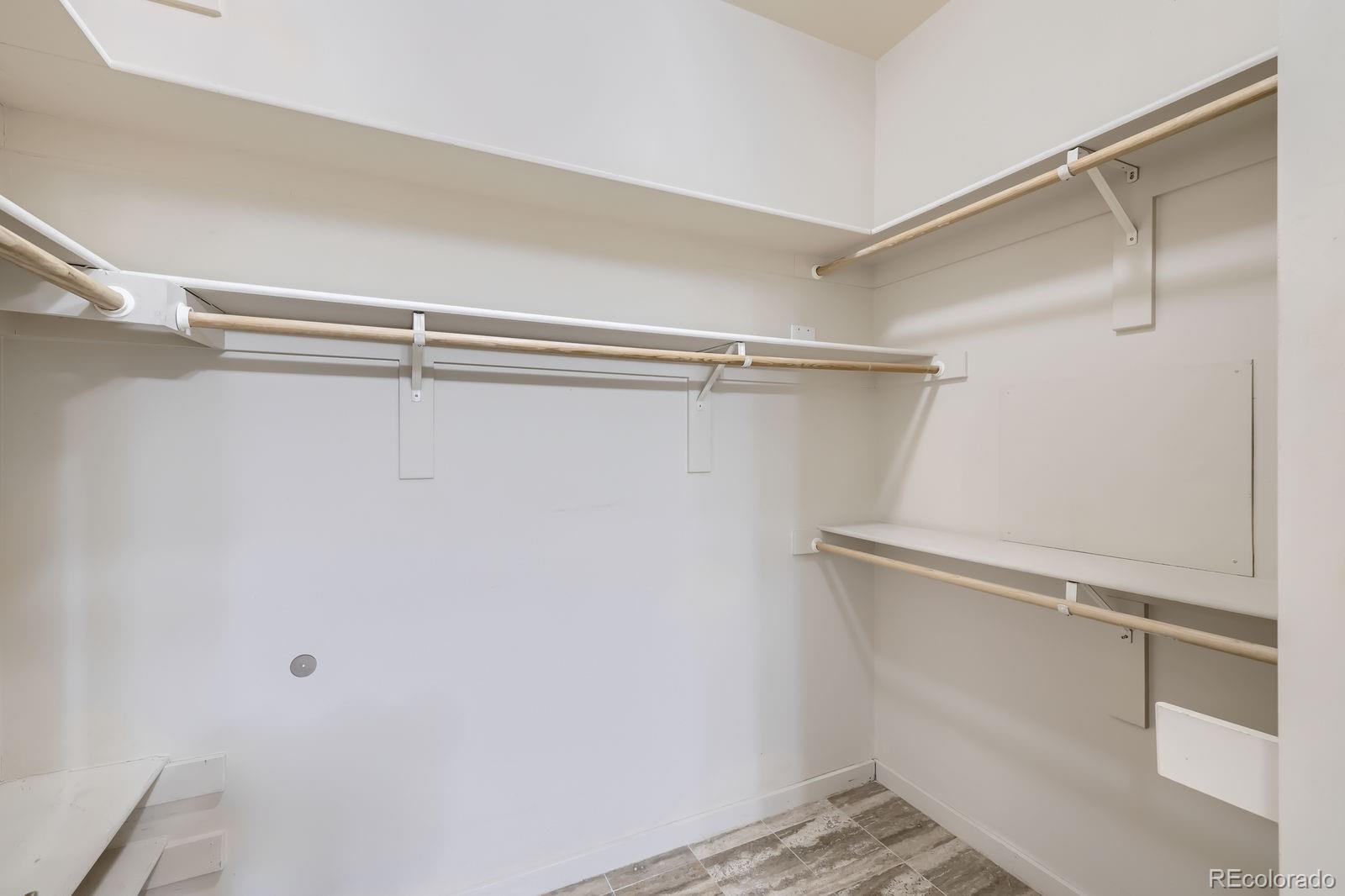 4875 South Monaco Street, Unit 103 Denver, CO 80237 - Photo 12 of 44 a view of a room with racks on the wall