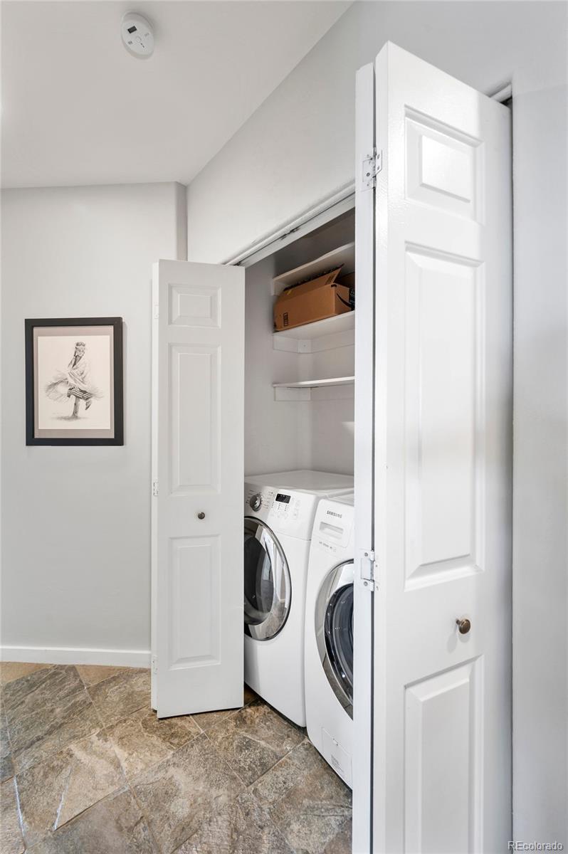 4875 South Monaco Street, Unit 103 Denver, CO 80237 - Photo 19 of 44 a utility room with dryer and washer