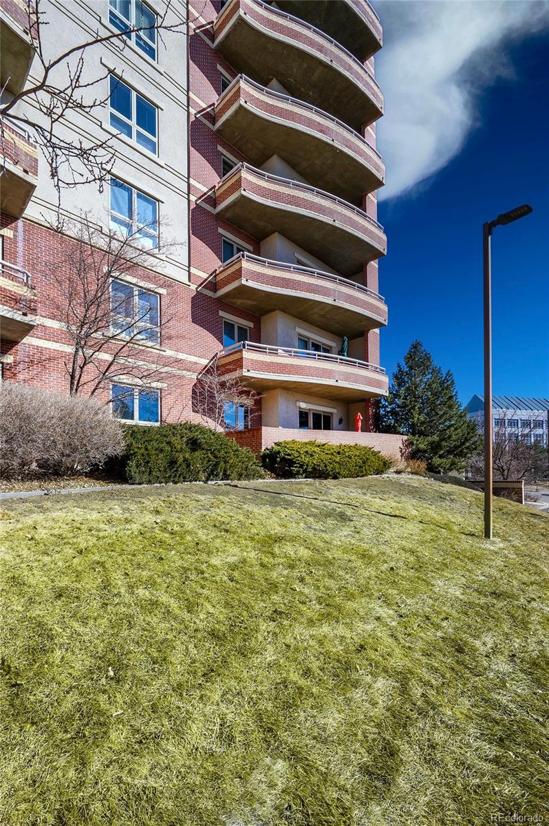 4875 South Monaco Street, Unit 103 Denver, CO 80237 - Photo 2 of 44 a front view of a building with street