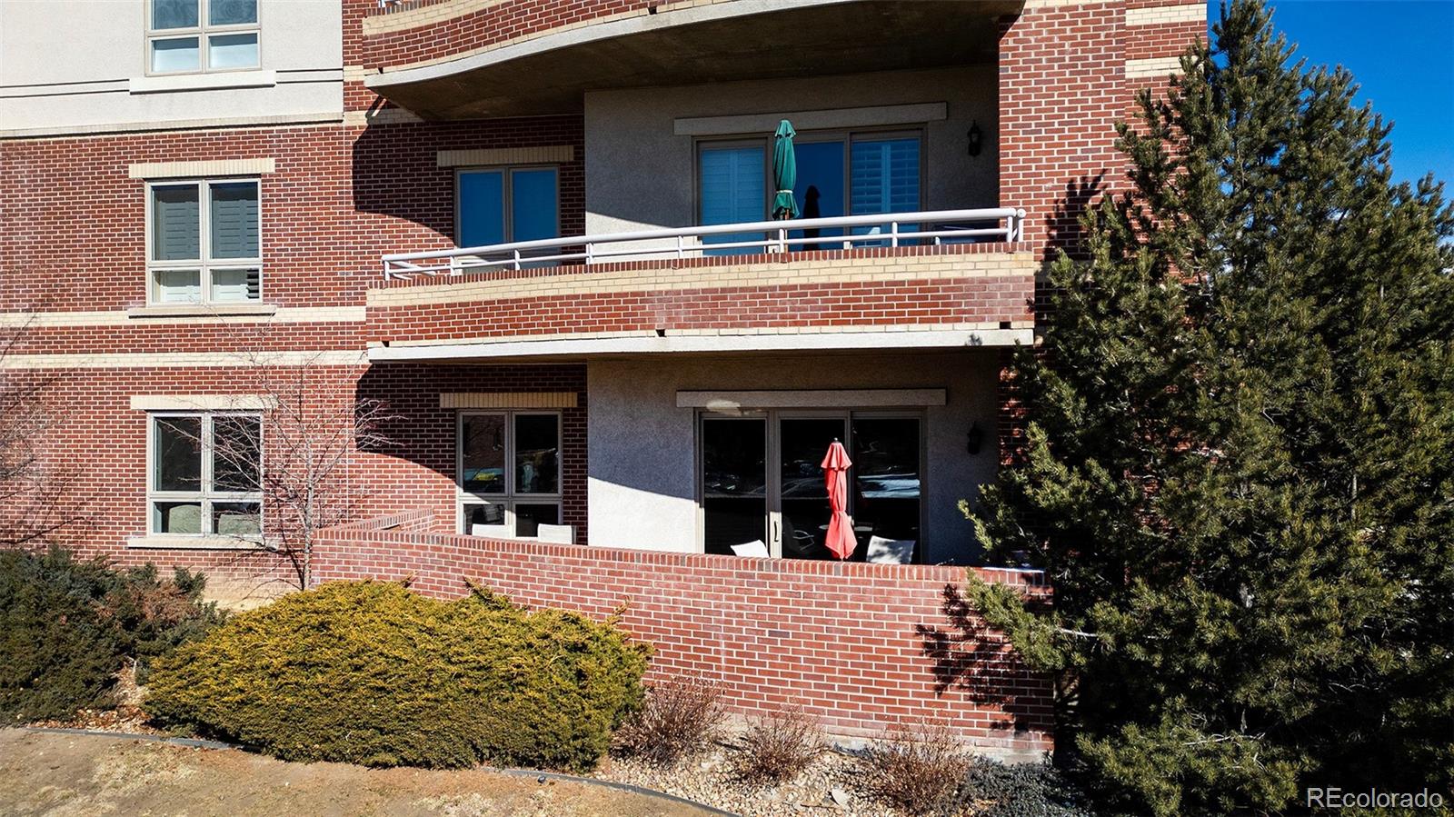4875 South Monaco Street, Unit 103 Denver, CO 80237 - Photo 24 of 44 a view of a building with large windows