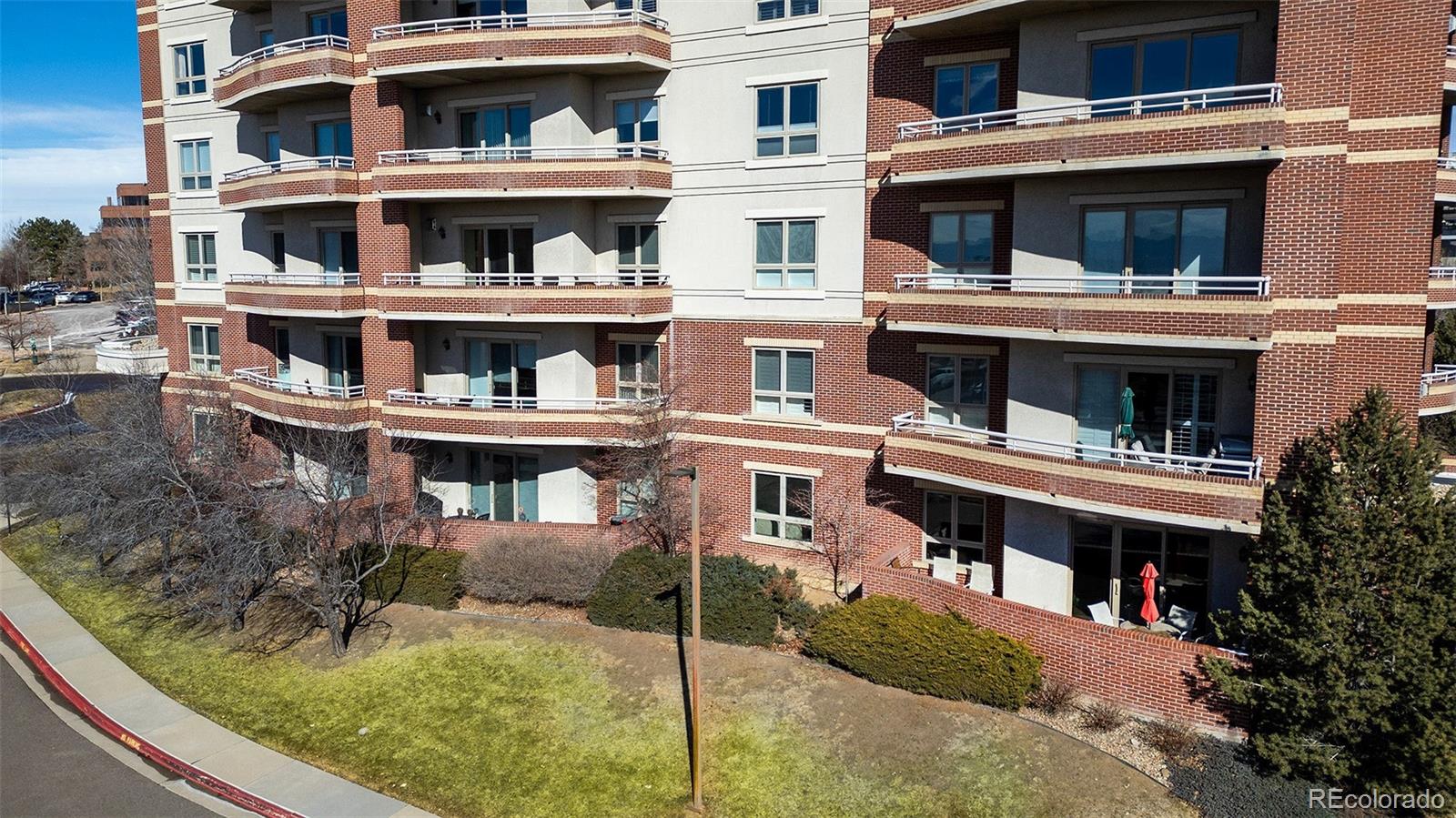 4875 South Monaco Street, Unit 103 Denver, CO 80237 - Photo 25 of 44 a view of a large building with a lot of windows