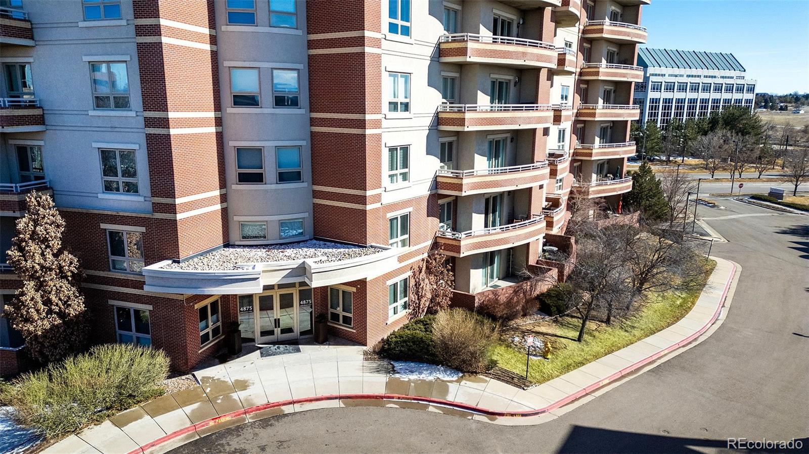 4875 South Monaco Street, Unit 103 Denver, CO 80237 - Photo 34 of 44 a view of buildings in front of a building