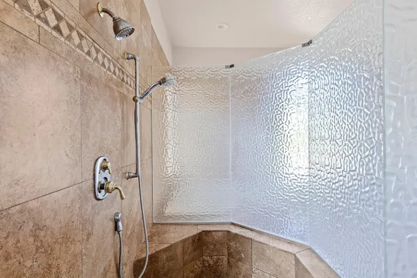 a bath tub sitting in a bathroom next to a window