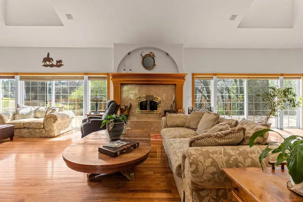 a very nice looking dining room with kitchen island furniture a large window and a counter space
