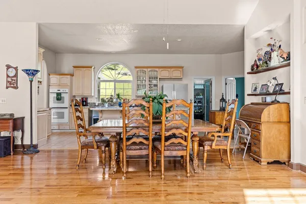 a kitchen with stainless steel appliances granite countertop a stove and a refrigerator