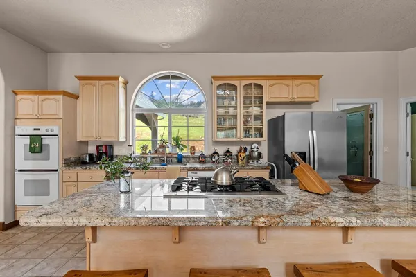 a bedroom with a bed and flat screen tv