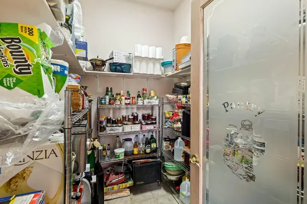 a bathroom with a walk in closet and bathroom
