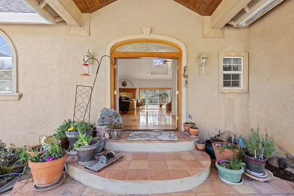 a view of a entryway with flower pots