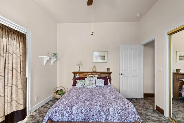 a bathroom with a toilet a sink and a mirror