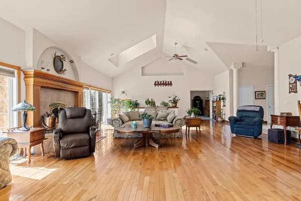 a living room with furniture or couch and a wooden floor
