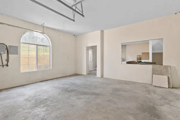 a view of a large pool with an outdoor space and seating area