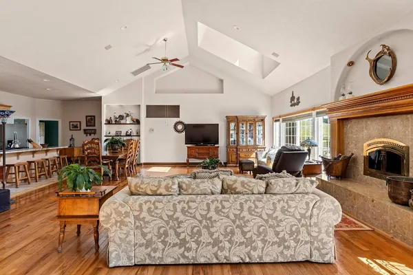 a view of a livingroom with furniture and a large window