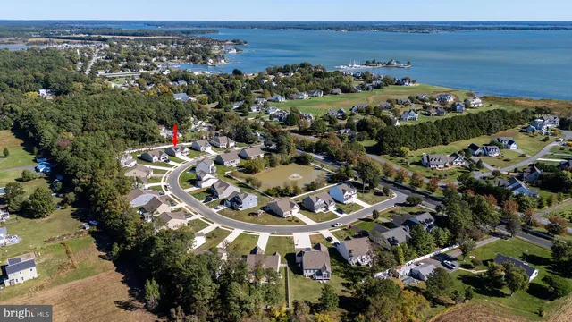 an aerial view of residential house with outdoor space and swimming pool