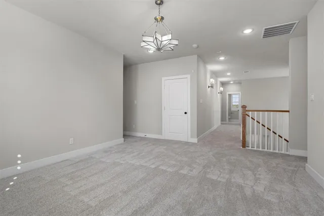 en view interior of a house with stairs and chandelier