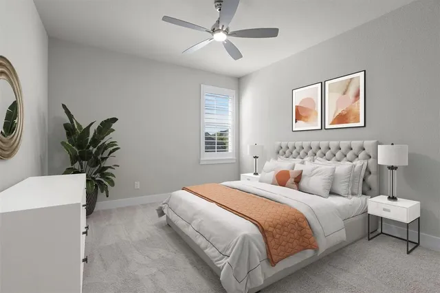 a bedroom with bed and a potted plant